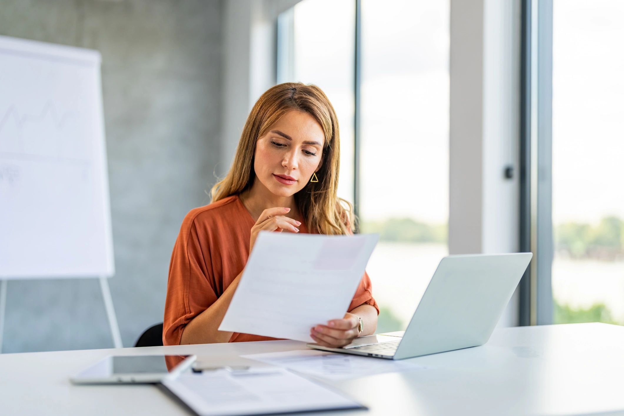 One person working with documents at a desk